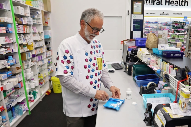 Pharmacist counting tablets