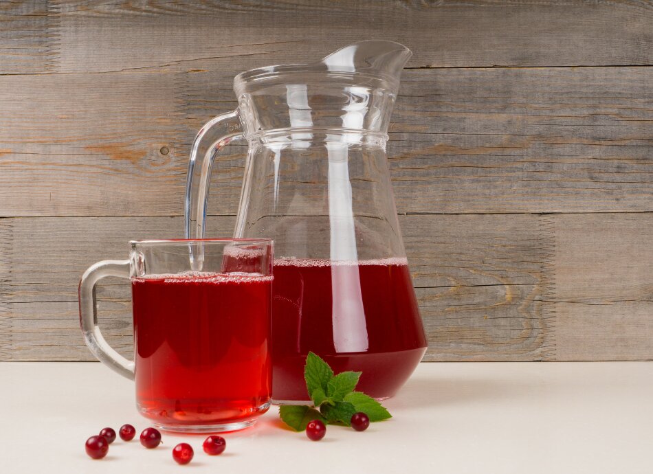 Cranberry juice in a glass and jug