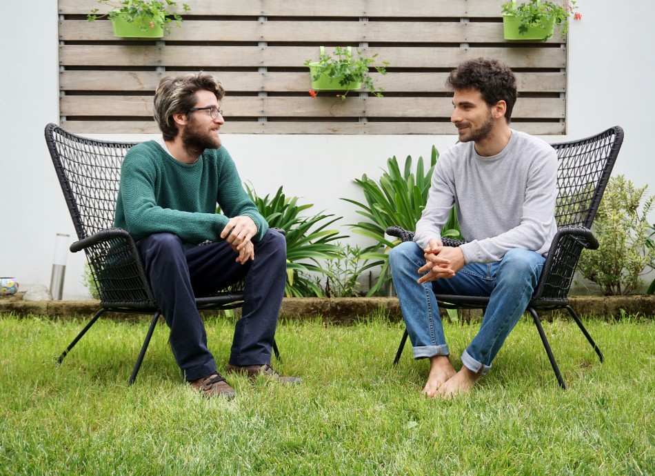 Men sitting in garden talking